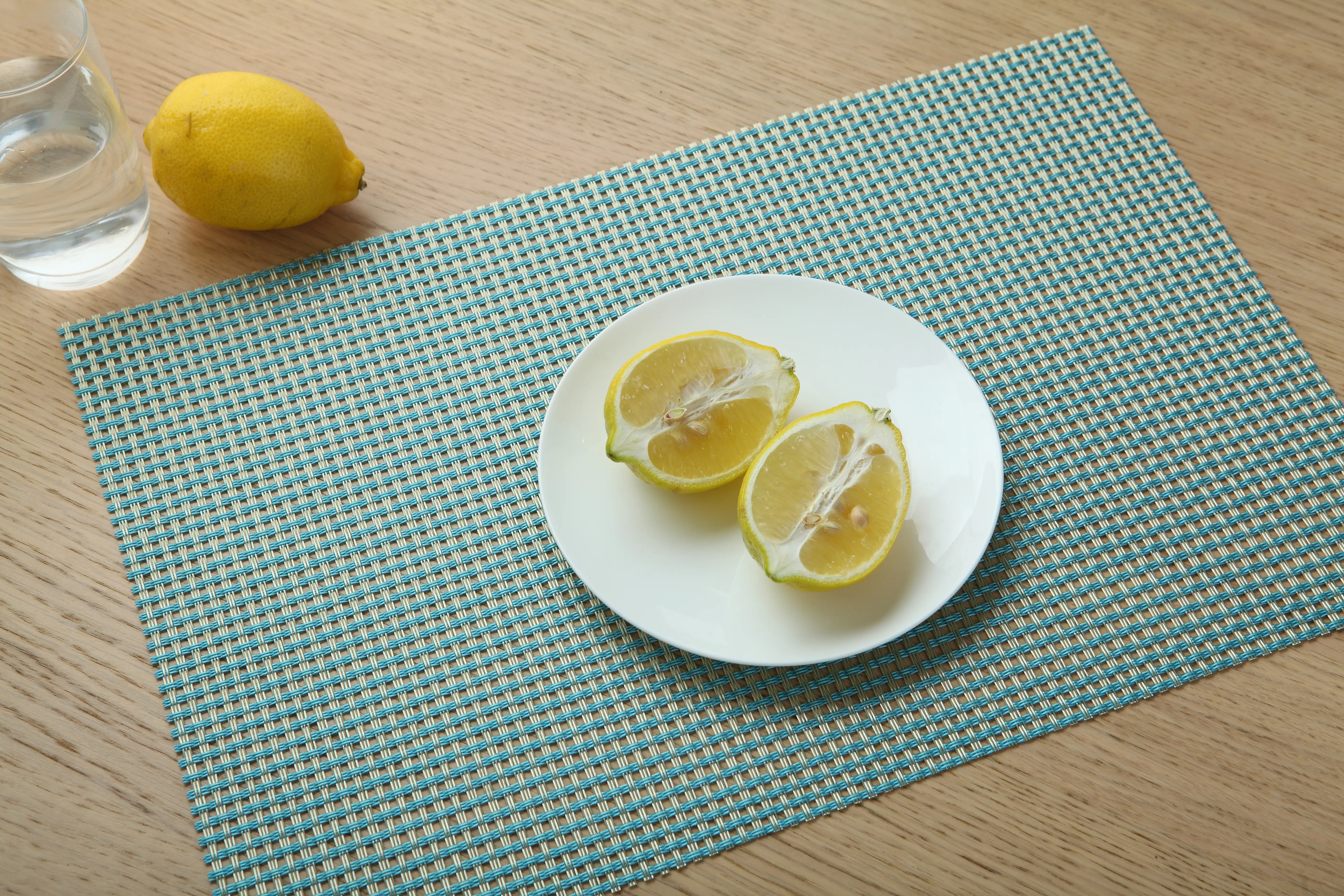 AOLEADER woven material used as a decorative placemat on a dining table